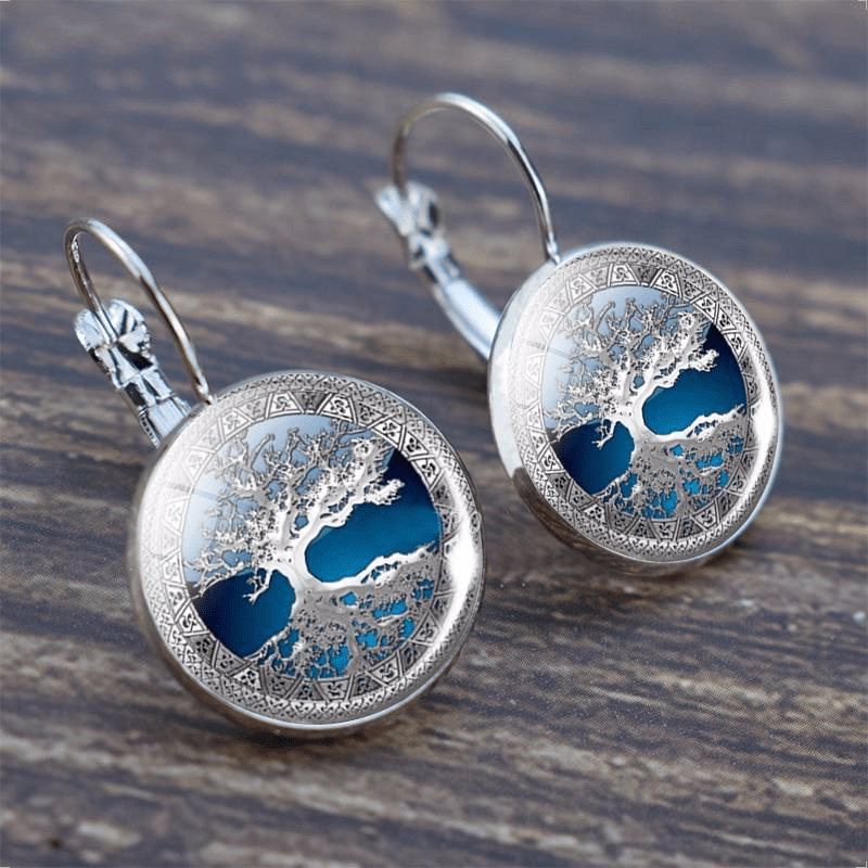 Sylvara™ | Silver Tree of Life Hoop Earrings" can be rewritten as:

"Sylvara™ | Silver Hoop Earrings with Tree of Life Design